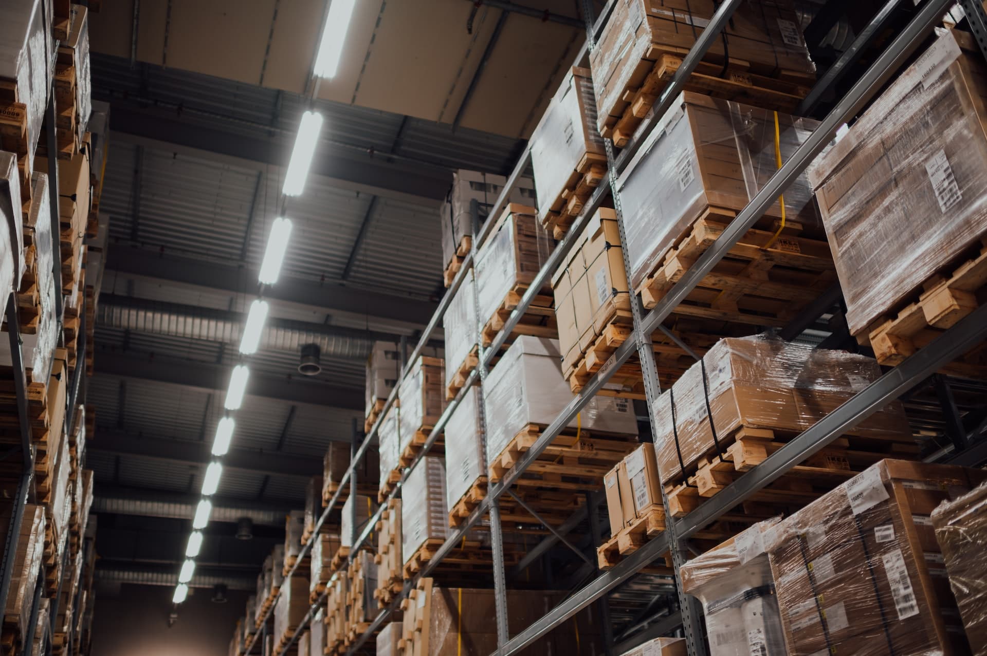 A warehouse filled with stacks of boxes, containing a variety of supplies