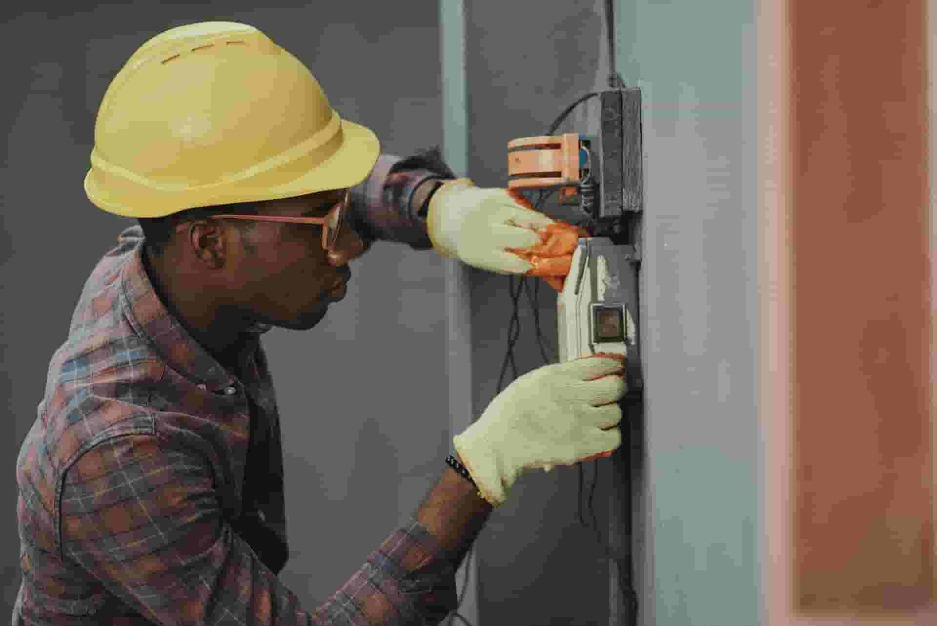 a technician repairing electrical equipment